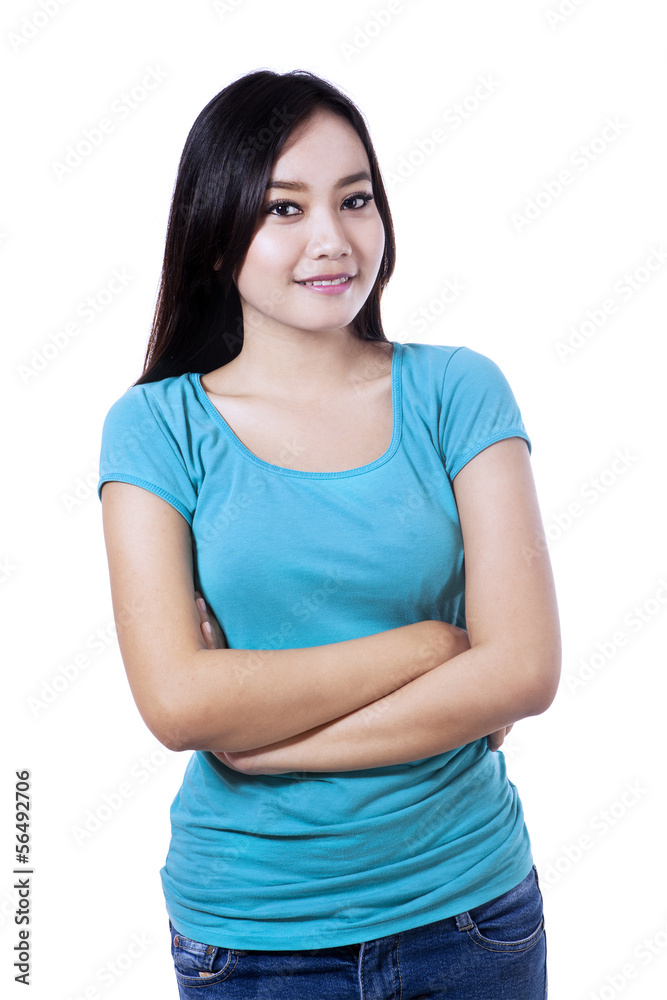 Smiling woman with arms folded - isolated Smiling woman with arms folded - isolated