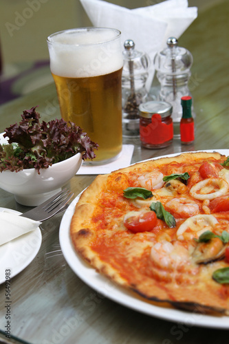 Seafood Pizza with salad and beer