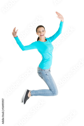 Jumping happy young woman