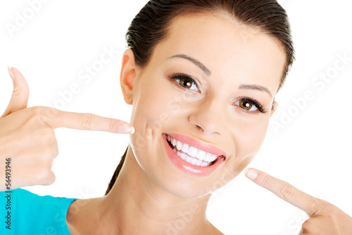 Woman showing her perfect  teeth. #56493946