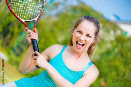 Sportswoman with racket at the tennis court © spass