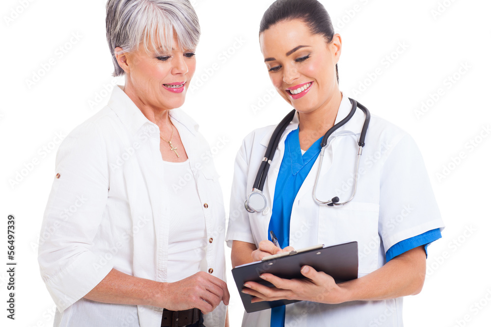 doctor helping senior woman with medical form doctor helping senior woman with medical form