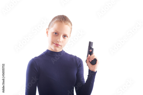 Cute teen girl with gun isolated on white