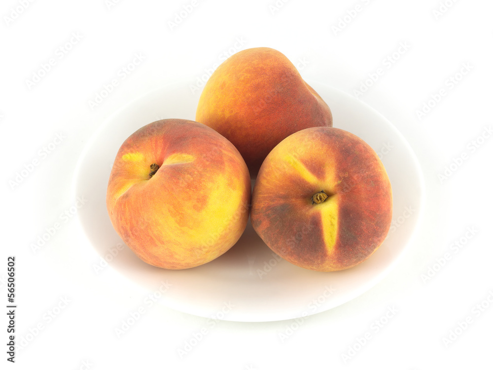 Three fresh Peaches on plate isolated on white close up Three fresh Peaches on plate isolated on white close up