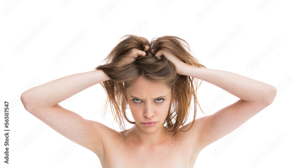 Bare natural woman looking angry at camera Bare natural woman looking angry at camera