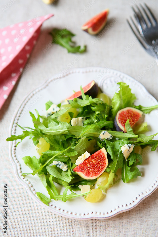 fresh salad with cheese, rocket salad and grapes fresh salad with cheese, rocket salad and grapes