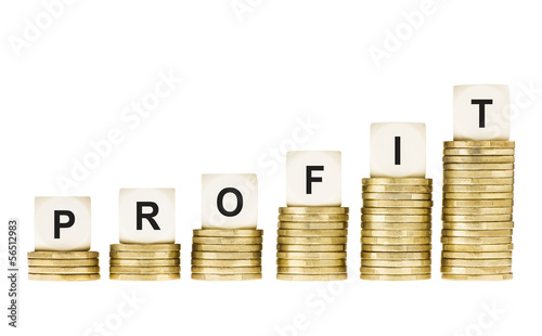 Word PROFIT on Row of Gold Coin Stacks Isolated White photo