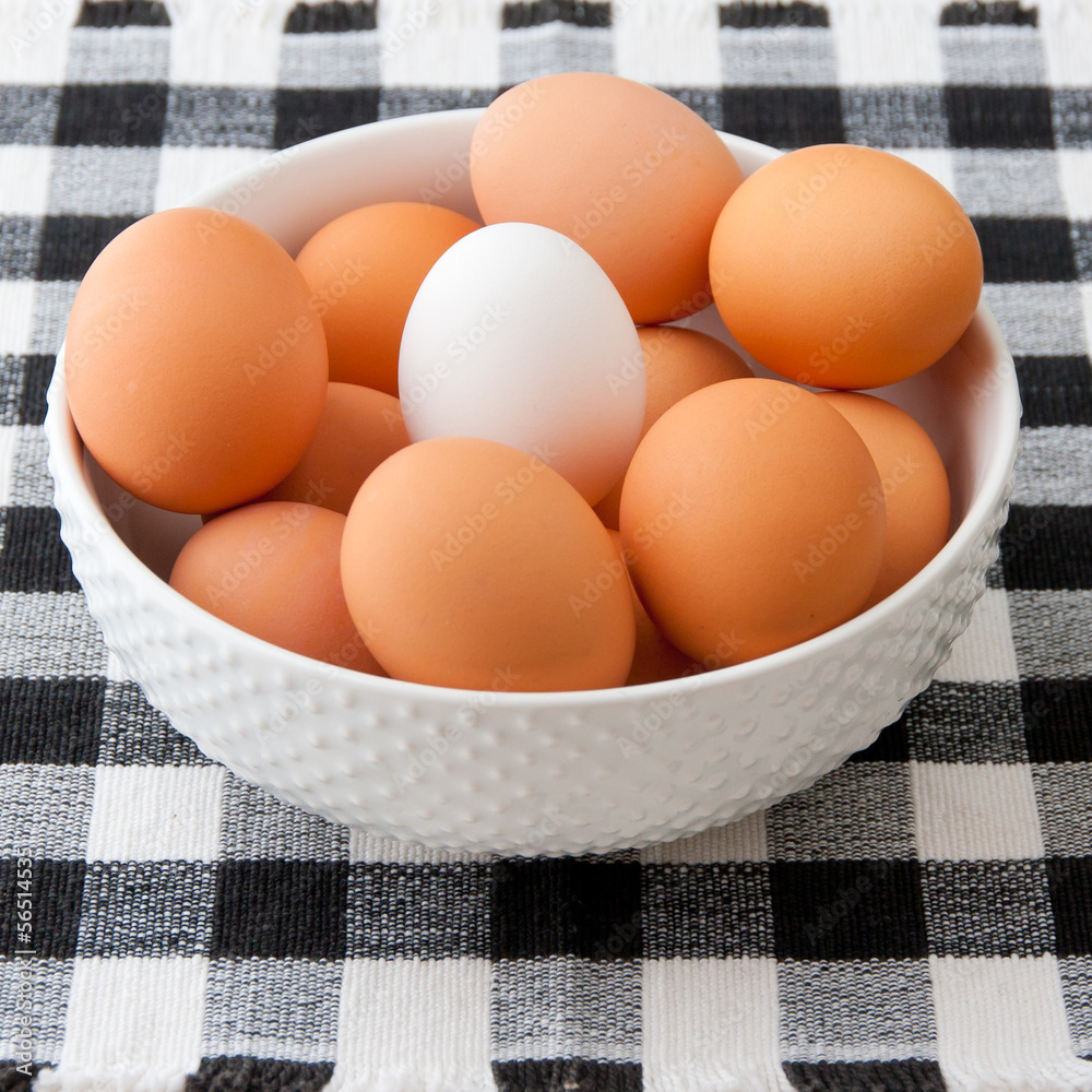 Eggs in a bowl. One of a kind concept Eggs in a bowl. One of a kind concept
