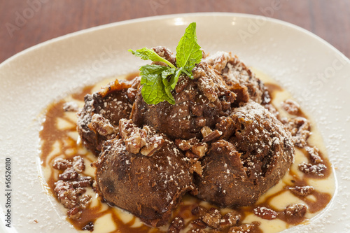 chocolate turtle beignets with creme anglais photo