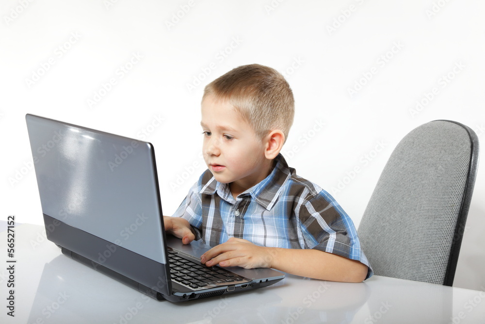 Computer addiction child with laptop notebook Computer addiction child with laptop notebook