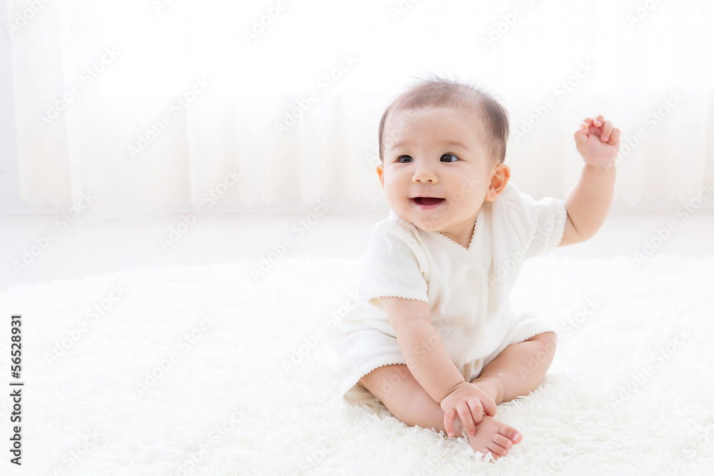asian baby relaxing on the carpet asian baby relaxing on the carpet