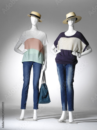 Full female clothing in jeans with bag on two mannequin photo