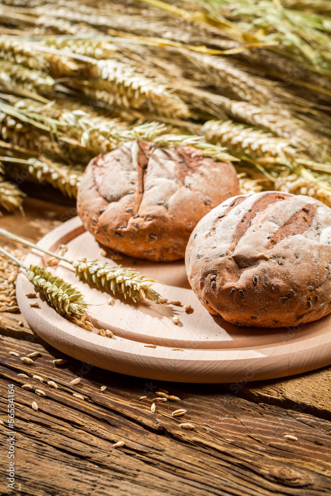 Closeup of two buns with grains and ears Closeup of two buns with grains and ears
