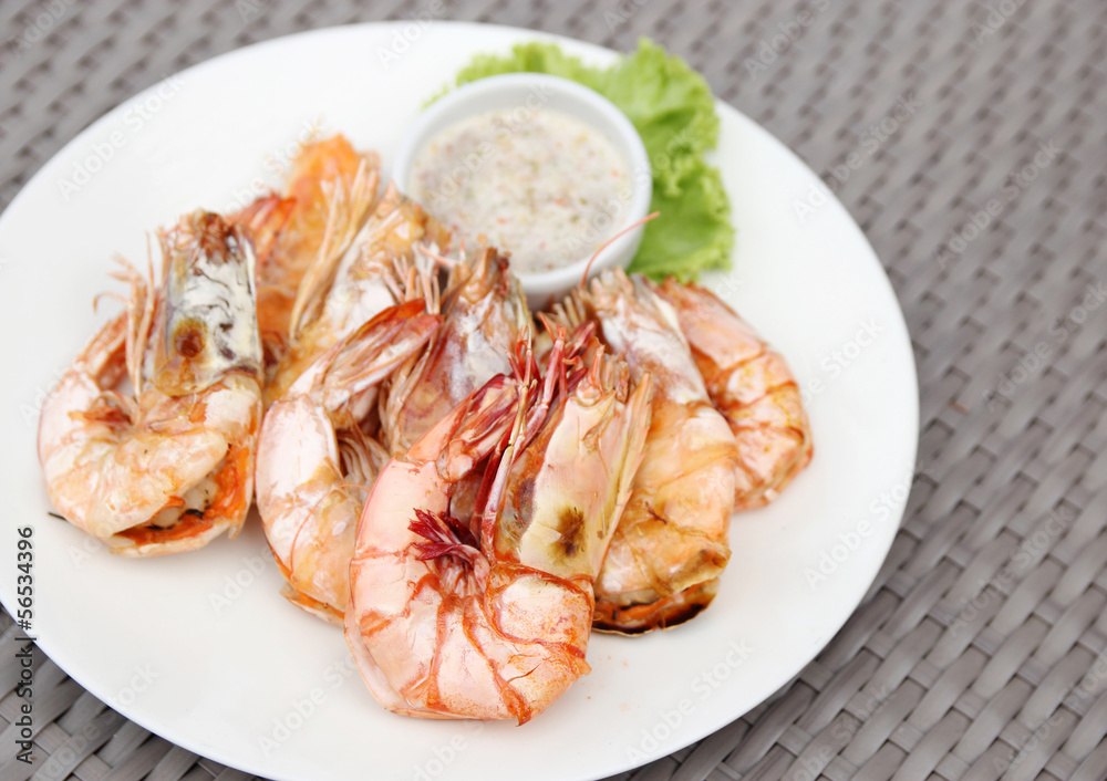 grilled shrimps with seafood sauce on white plate grilled shrimps with seafood sauce on white plate