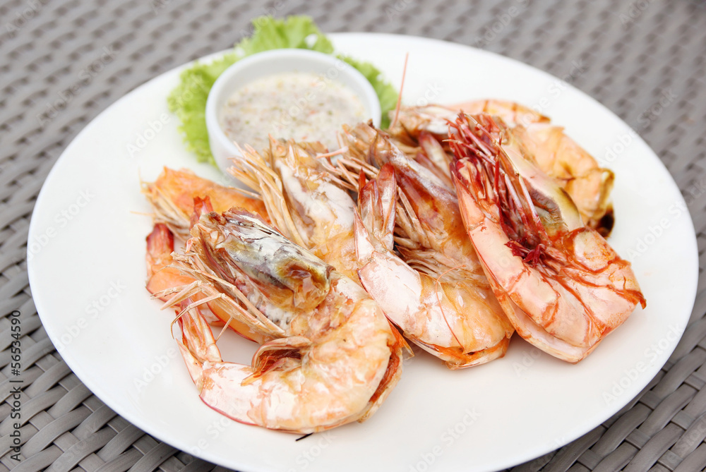 grilled shrimps with seafood sauce on white plate grilled shrimps with seafood sauce on white plate