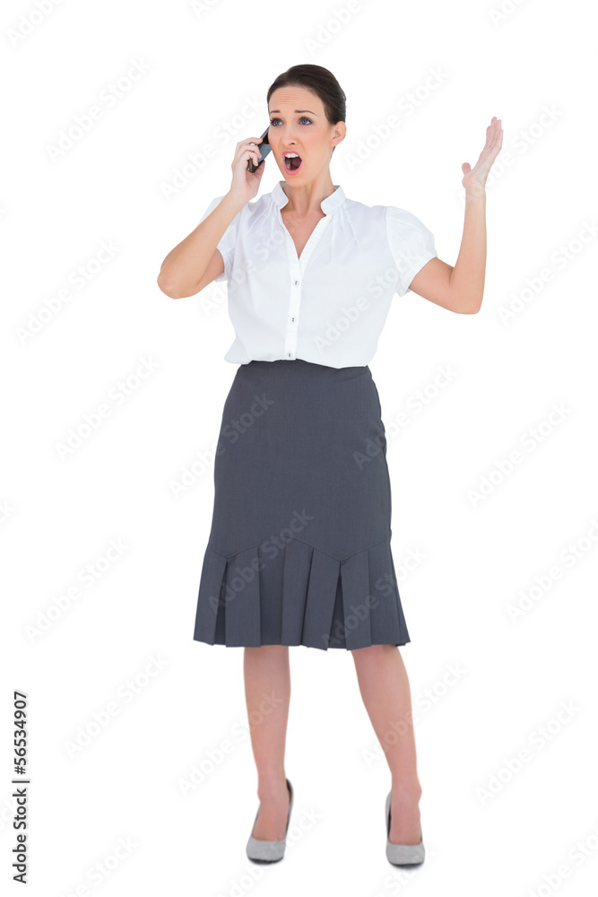 Angry businesswoman having a phone call