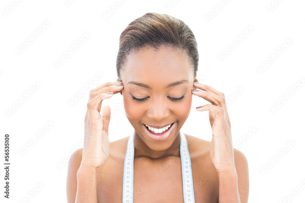 Cheerful natural beauty with measuring tape over the neck Cheerful natural beauty with measuring tape over the neck