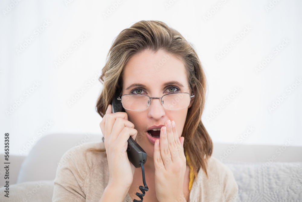 Astonished pretty woman having a phone call Astonished pretty woman having a phone call