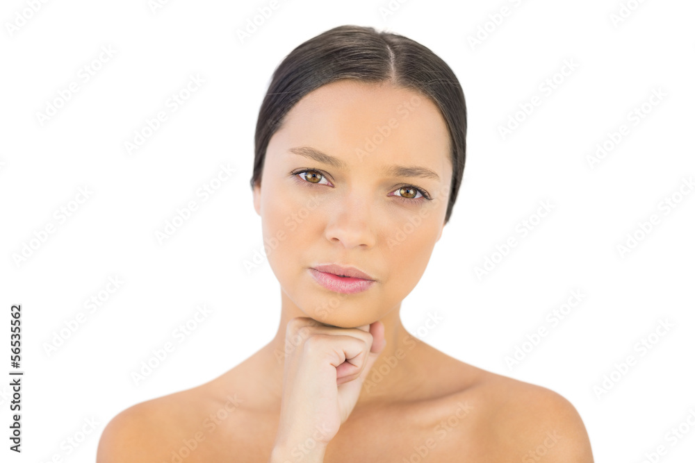 Serious gorgeous brunette with hand under chin posing Serious gorgeous brunette with hand under chin posing