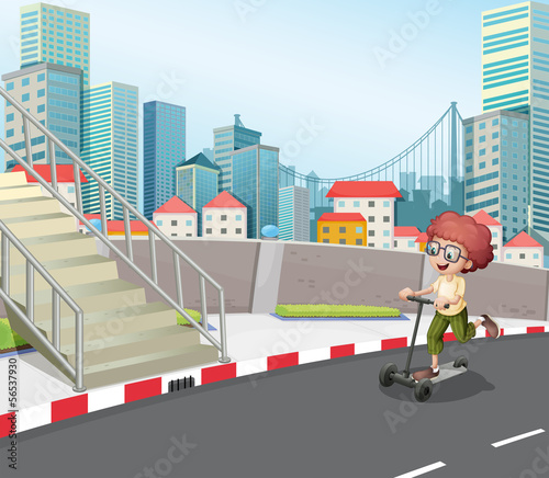 A boy skateboarding at the street