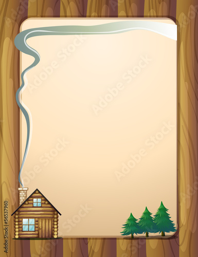 A wooden frame with a house and trees