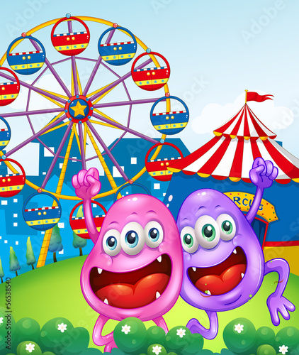 Two happy monsters near the carnival