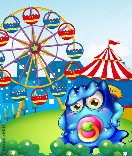 A baby blue monster at the carnival