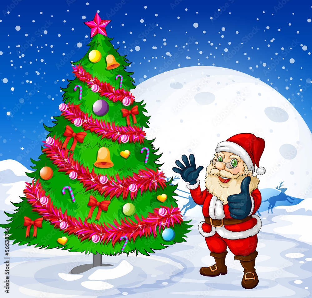 A smiling santa beside the giant christmas tree A smiling santa beside the giant christmas tree
