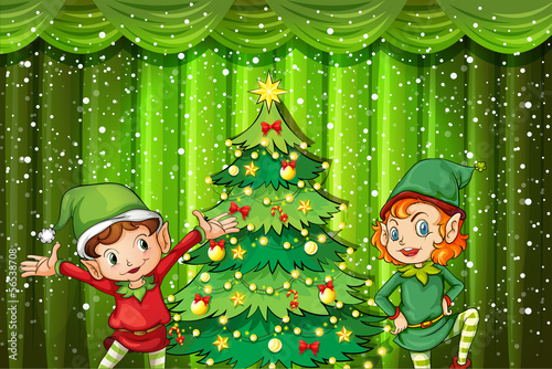 Two elves near the christmas tree