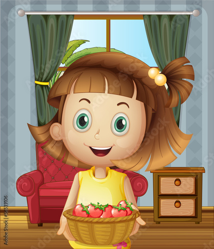 A girl inside the house holding a basket of strawberries