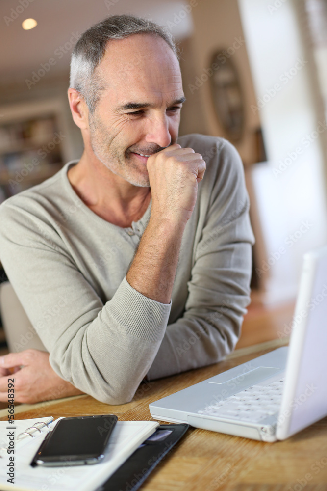 Mature man working from home