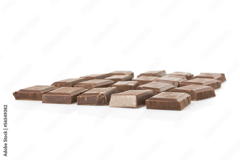 Dark chocolate bar broken into squares isolated on white Dark chocolate bar broken into squares isolated on white