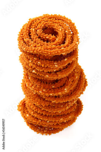 Traditional indian snack - chakali, isolated on white. photo