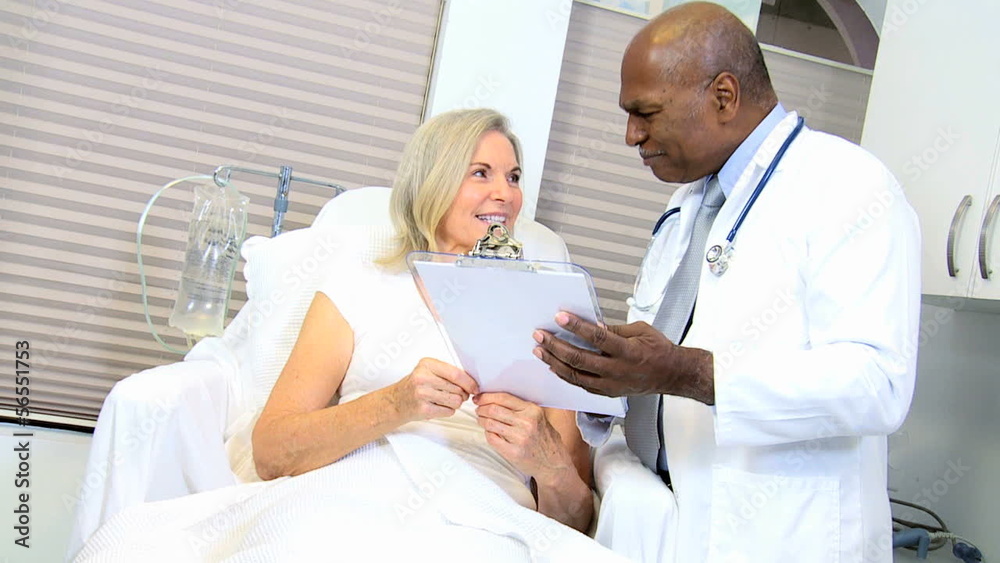 Male African American Doctor Treating Hospital Patient Male African American Doctor Treating Hospital Patient