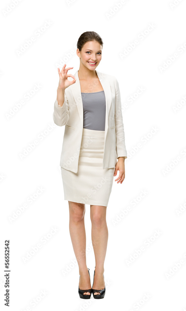 Full-length portrait of business woman okay gesturing Full-length portrait of business woman okay gesturing