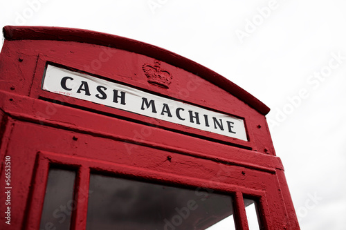Red telephone booth converted to cash machine