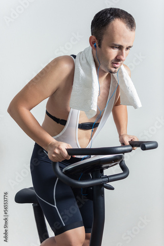 Man exercising on stationary bike