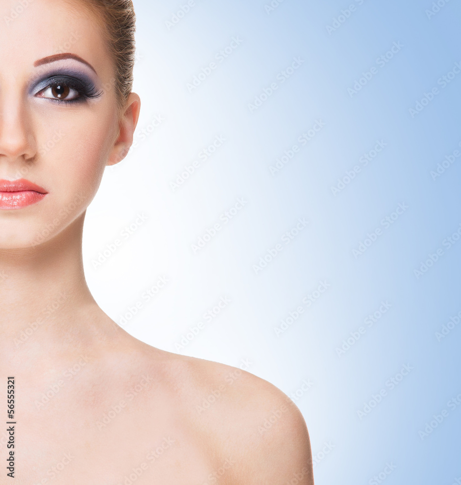 Naklejka premium Portrait of a young and beautiful woman in makeup