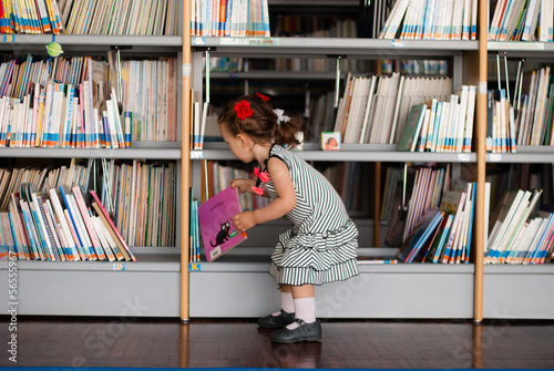 Baby girl reading book