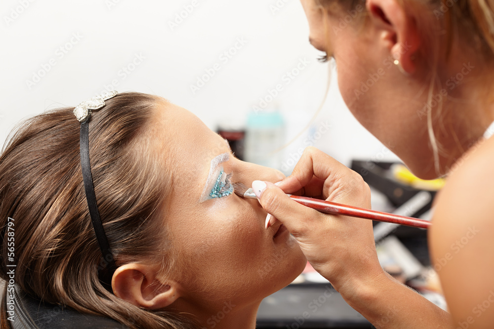 Model having makeup applied Model having makeup applied