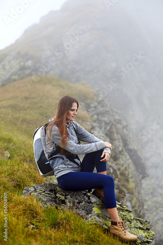 Woman hiker on a mountain trail