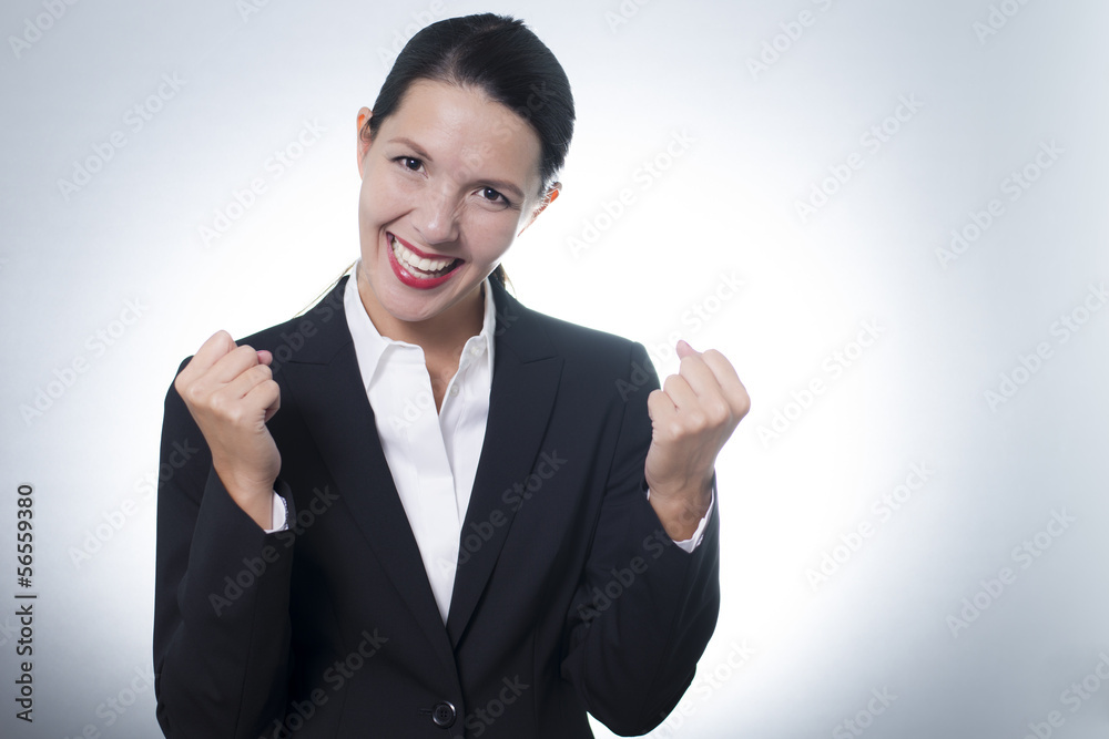 Jubilant businesswoman cheering Jubilant businesswoman cheering