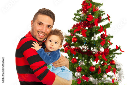 Funny father and his son near Xmas tree