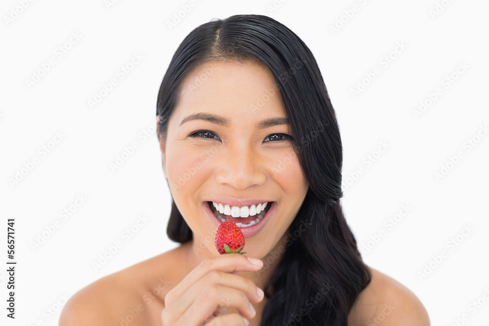 Gorgeous brown haired model eating strawberry Gorgeous brown haired model eating strawberry