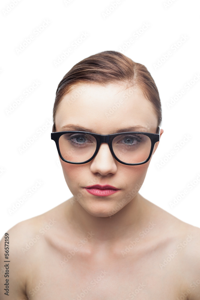 Unsmiling clean model with classy glasses posing Unsmiling clean model with classy glasses posing