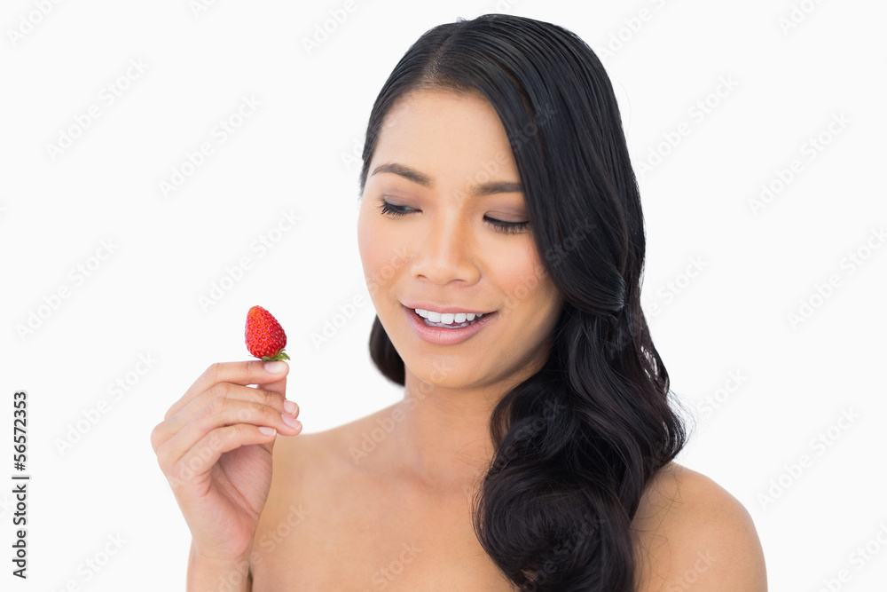 Natural brown haired model with strawberry Natural brown haired model with strawberry