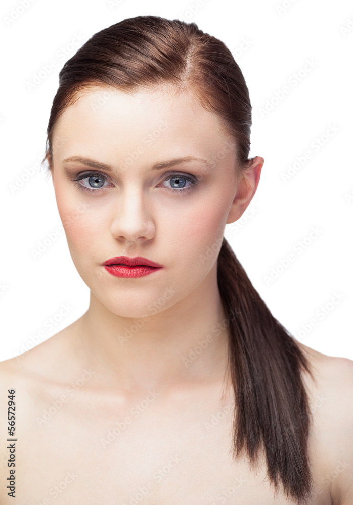 Unsmiling gorgeous model with ponytail posing Unsmiling gorgeous model with ponytail posing