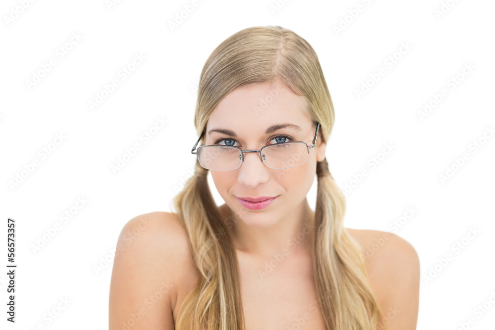 Serious young blonde woman looking over her glasses Serious young blonde woman looking over her glasses