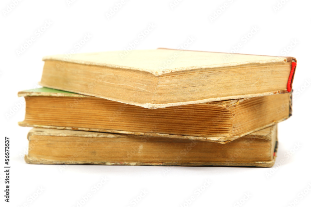 Stack of old books on a white background.