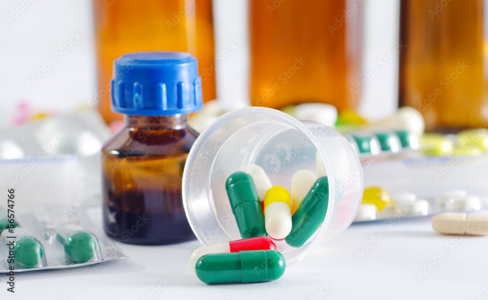 color pills and medical bottle